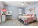 Charming bedroom with a unique aesthetic featuring wood-look flooring, and modern fixtures at 16532 W Rowel Rd, Surprise, AZ 85387