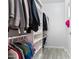 Spacious walk-in closet with built-in shelves and rods, perfect for organizing clothes and accessories at 16532 W Rowel Rd, Surprise, AZ 85387