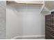 Bright closet featuring neutral walls, modern flooring, storage, and a hanging rod at 16532 W Rowel Rd, Surprise, AZ 85387