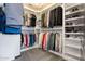 Organized walk-in closet with shelving for shoes and hanging space for clothes at 16532 W Rowel Rd, Surprise, AZ 85387