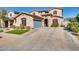 Beautiful house showcasing a well-kept lawn and a two-car garage at 16532 W Rowel Rd, Surprise, AZ 85387