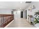 Upstairs hallway with decorative wood railings and stylish decor at 16532 W Rowel Rd, Surprise, AZ 85387