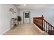 Upstairs hallway featuring wood railings and decorative shelving at 16532 W Rowel Rd, Surprise, AZ 85387