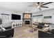 Inviting living room features a fireplace, large tv, and an open layout at 16532 W Rowel Rd, Surprise, AZ 85387