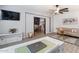 Inviting living room features a stylish desk, comfortable seating, and a ceiling fan for added comfort at 16532 W Rowel Rd, Surprise, AZ 85387