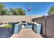 Built-in outdoor kitchen with BBQ grill and counter space is perfect for entertaining in the backyard at 16532 W Rowel Rd, Surprise, AZ 85387