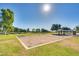 Enjoy a community sand volleyball court with well-maintained grassy surroundings on a clear, sunny day at 16532 W Rowel Rd, Surprise, AZ 85387