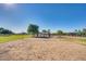 The community includes a sand volleyball court, picnic area, and playground on a sunny day at 16532 W Rowel Rd, Surprise, AZ 85387