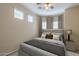 This bedroom offers natural light and features a ceiling fan at 16830 W Magnolia St, Goodyear, AZ 85338