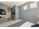 This bedroom offers natural light and features easy access to the ensuite bathroom at 16830 W Magnolia St, Goodyear, AZ 85338