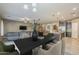 Elegant dining room area with modern decor open to the living room and kitchen at 16830 W Magnolia St, Goodyear, AZ 85338