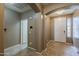 Inviting foyer featuring neutral tile flooring and an arched entryway at 16830 W Magnolia St, Goodyear, AZ 85338