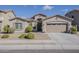 Charming single-story home with desert landscaping and a two-car garage at 16830 W Magnolia St, Goodyear, AZ 85338