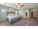 Serene primary bedroom suite featuring plush carpeting and a calming color palette at 16830 W Magnolia St, Goodyear, AZ 85338