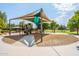 Well-equipped community playground featuring slides, covered play areas and ample space for recreation at 16830 W Magnolia St, Goodyear, AZ 85338