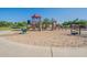 Community playground featuring climbing structures, slides, and recreational equipment for enjoyment at 16830 W Magnolia St, Goodyear, AZ 85338