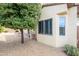 Exterior shot of a house with gravel, desert foliage, and an outdoor grill at 19140 N Tamarisk Flower Way, Surprise, AZ 85387