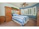 Inviting bedroom featuring a built-in wardrobe, neutral carpet and generous natural light at 19140 N Tamarisk Flower Way, Surprise, AZ 85387
