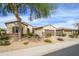 Charming single-story home featuring stone accents, desert landscaping, and a three-car garage at 19140 N Tamarisk Flower Way, Surprise, AZ 85387