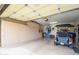 Large garage with built in storage cabinets and room for a golf cart or other recreational vehicle at 19140 N Tamarisk Flower Way, Surprise, AZ 85387