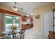 Eat-in kitchen featuring updated appliances, tile floors and an outdoor view at 19140 N Tamarisk Flower Way, Surprise, AZ 85387