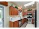 Modern kitchen with stainless steel appliances, quartz countertops, and ample cabinet space at 19140 N Tamarisk Flower Way, Surprise, AZ 85387