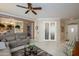 Inviting living area with tile flooring and open layout to the kitchen, perfect for entertaining at 19140 N Tamarisk Flower Way, Surprise, AZ 85387