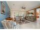 Comfortable living room featuring neutral color scheme and an open layout to the kitchen at 19140 N Tamarisk Flower Way, Surprise, AZ 85387