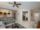 Inviting living area with tile flooring and open layout to the office, perfect for entertaining at 19140 N Tamarisk Flower Way, Surprise, AZ 85387