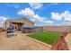 Backyard features an above-ground pool, patio area, turf lawn, and low-maintenance desert landscaping at 21816 W Taft Ave, Wittmann, AZ 85361