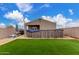 This backyard showcases an above-ground pool, artificial turf, barbecue, and privacy at 21816 W Taft Ave, Wittmann, AZ 85361