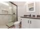 Modern bathroom features a glass shower, stylish vanity, and contemporary fixtures at 21816 W Taft Ave, Wittmann, AZ 85361