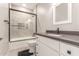 Clean bathroom with a shower over bath, stylish vanity, and contemporary fixtures at 21816 W Taft Ave, Wittmann, AZ 85361