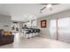 Open living space blends into a modern kitchen with a breakfast bar and ample seating at 21816 W Taft Ave, Wittmann, AZ 85361