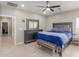 Comfortable main bedroom with ceiling fan, stylish furnishings, and ample natural light at 21816 W Taft Ave, Wittmann, AZ 85361