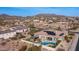 Expansive aerial of a home with a pool, outdoor kitchen, patio, and mountain views at 2224 N 83Rd Cir, Mesa, AZ 85207