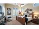 Cozy bedroom with a king-size bed, shuttered windows, and stylish decor at 2224 N 83Rd Cir, Mesa, AZ 85207