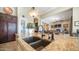 Granite kitchen island with dual sink, a modern faucet, and backyard views at 2224 N 83Rd Cir, Mesa, AZ 85207