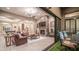 Expansive living room with pool table visible through the open entryway, and a stone fireplace at 2224 N 83Rd Cir, Mesa, AZ 85207