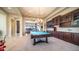 Spacious living area with a pool table, custom cabinetry, and an open layout for entertaining at 2224 N 83Rd Cir, Mesa, AZ 85207