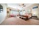 Expansive main bedroom suite with sitting area, ceiling fans, and plenty of natural light at 2224 N 83Rd Cir, Mesa, AZ 85207