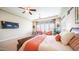 Cozy main bedroom showcasing a comfortable sitting area and ample natural light at 2224 N 83Rd Cir, Mesa, AZ 85207
