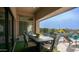 Covered outdoor dining area overlooking the pool and landscaped backyard at 2224 N 83Rd Cir, Mesa, AZ 85207