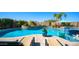 Beautiful pool surrounded by lush landscaping and lounge seating at 2224 N 83Rd Cir, Mesa, AZ 85207