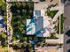 Aerial view of the home showing desert landscaping, grass, pool, play structure and tile roof at 2251 N 32Nd St # 10, Mesa, AZ 85213