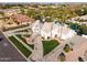 Stunning aerial view of a white home with meticulous landscaping and mature palm trees at 2251 N 32Nd St # 10, Mesa, AZ 85213
