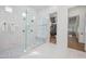 Stunning bathroom featuring a glass walk-in shower, marble tile and an adjacent walk-in closet at 2251 N 32Nd St # 10, Mesa, AZ 85213