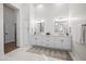 Elegant bathroom with double vanities, white cabinets, and refined fixtures at 2251 N 32Nd St # 10, Mesa, AZ 85213