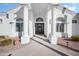 Covered front entry featuring double pillars, an arched window, and a black front door at 2251 N 32Nd St # 10, Mesa, AZ 85213