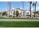Beautiful white home with tile roof, manicured lawn, and desert landscaping at 2251 N 32Nd St # 10, Mesa, AZ 85213